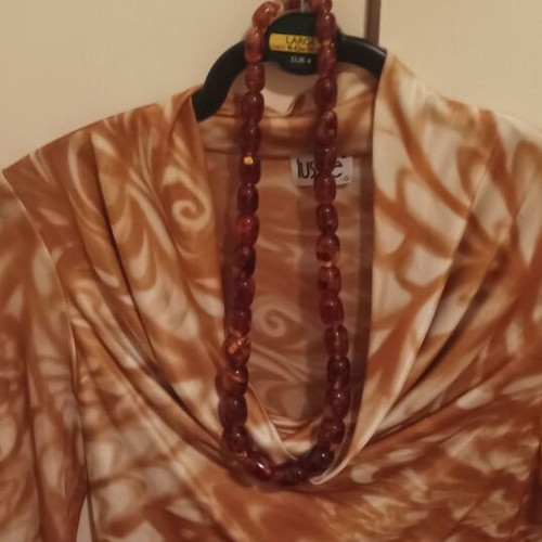 Amber necklace used with large stones in brown and orange tones