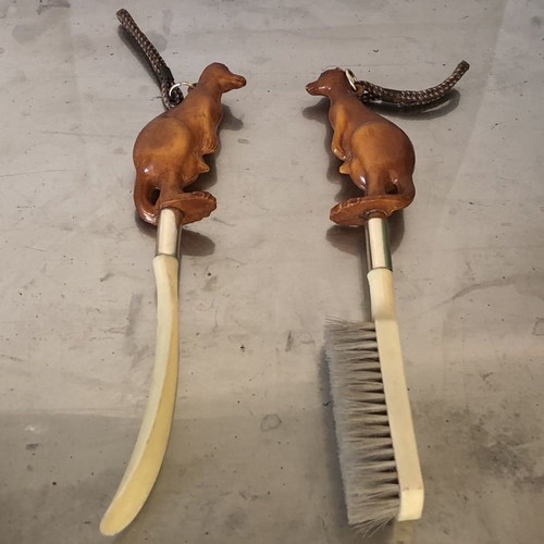 Shoe brush and shoehorn set used with kangaroo sculpture