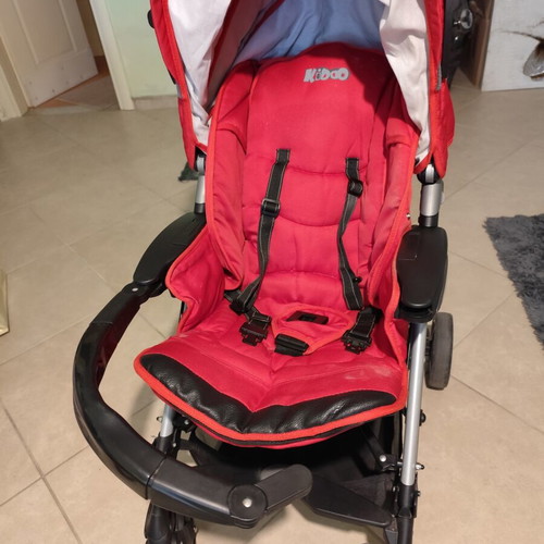 Kiddo Smart Deluxe stroller used with footmuff and changing bag, red