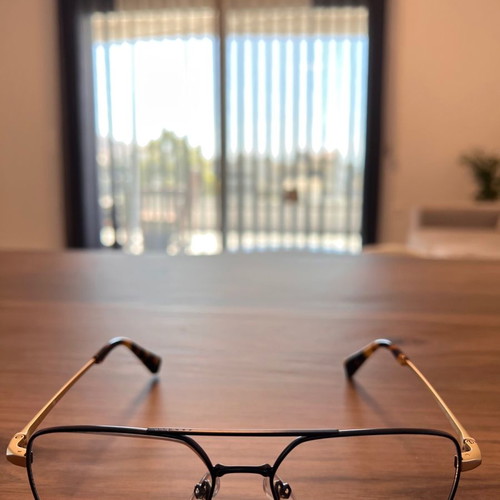 Sandro eyeglass frame new, black metal with gold arms