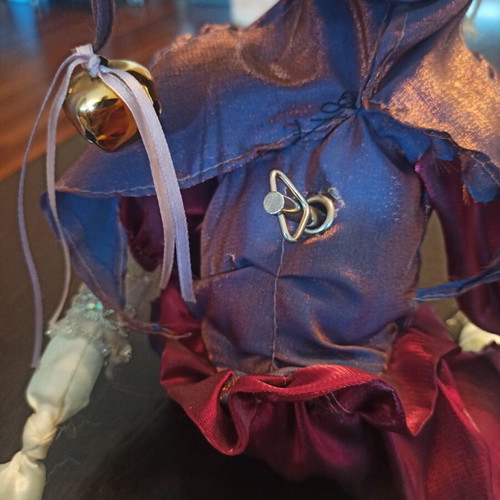 Wind-up Pierrot Harlequin doll used with music