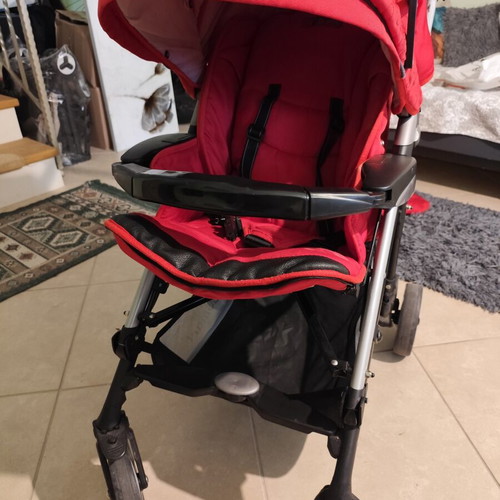 Kiddo Smart Deluxe stroller used with footmuff and changing bag, red