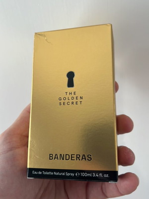 The Golden Secret Banderas perfume bottle used, empty