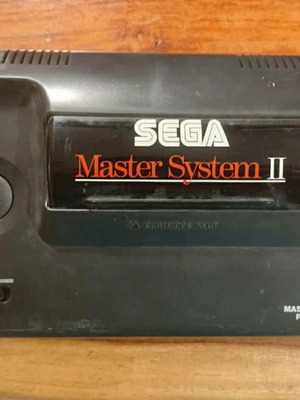 Sega Master System 2 console used with Alex Kidd and power supply