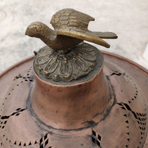 Old copper brazier used with brass handles and decorative bird