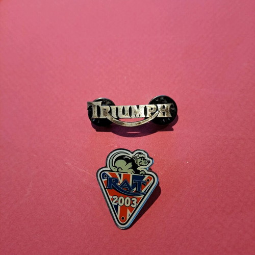 Triumph pins like new, set of 2