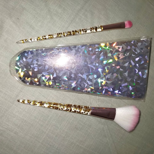 Makeup brushes used, set with small lipstick brush