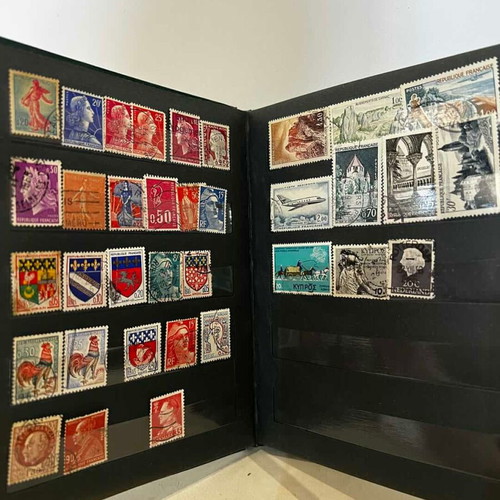 Stamp album with various collectible stamps used, 19x14.5 cm