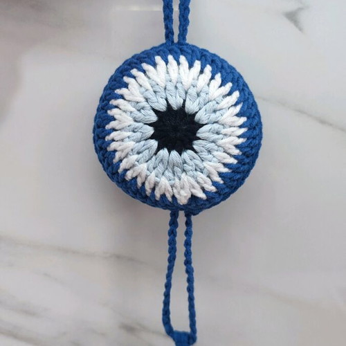 Handmade knitted eye in dark blue color
