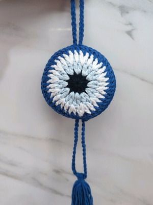 Handmade knitted eye in dark blue color