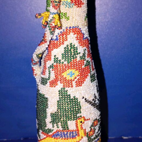Bottle used with beads and 1924 decoration