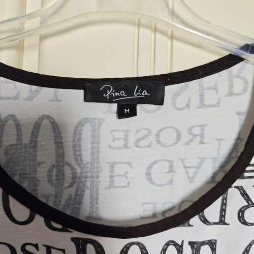 White short-sleeve cotton blouse with letters like new