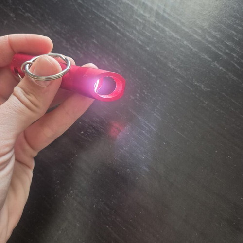 Mini LED flashlight keychain with bottle opener like new, red