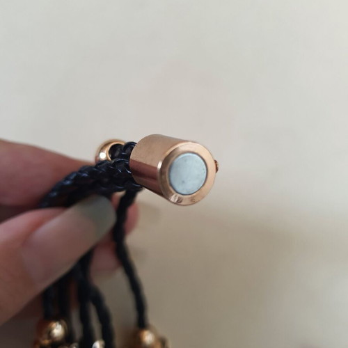 Black braided bracelet with gold beads and crystal clover like new