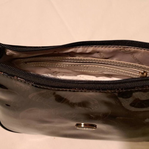Hexagona black patent leather shoulder bag with gold butterfly pattern