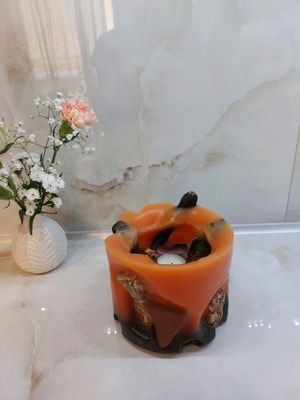 Handmade orange candle used for tealight