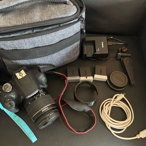Canon EOS 2000D camera with 3 batteries and extras, like new
