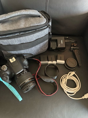Canon EOS 2000D camera with 3 batteries and extras, like new