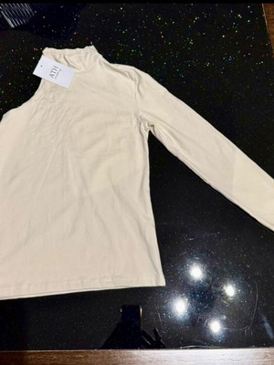 Turtleneck shirt new with tags, size small, beige