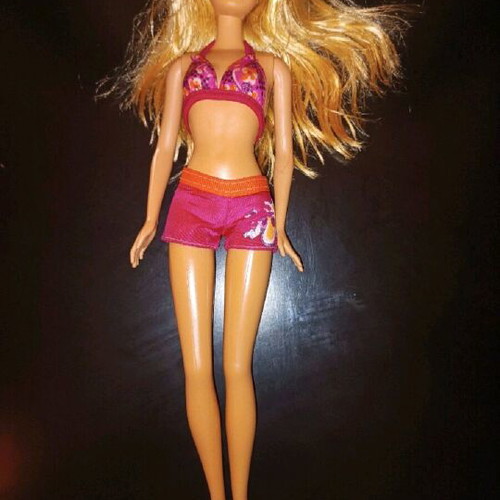 Barbie doll used with minor imperfections, authentic outfit