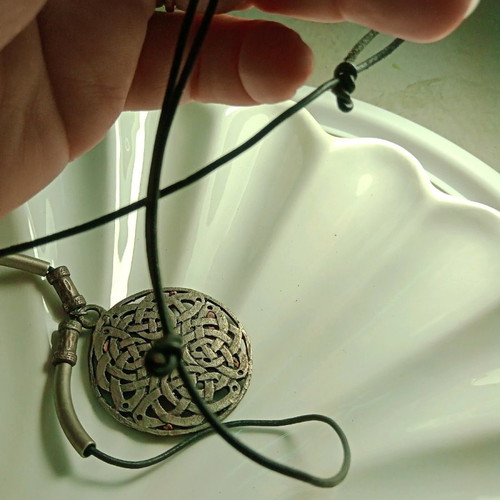 Pendant Celtic design like new with black adjustable leather strap