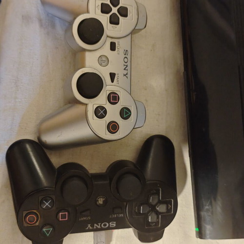 PlayStation 3 Super Slim console 1TB with controllers and games