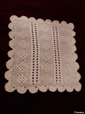 Set of doilies, two pieces, hand-crocheted, in ecru color.