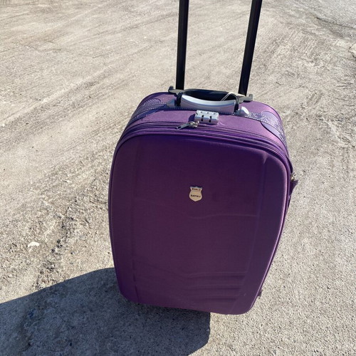 Medium sized luggage purple suitcase used, 2 wheels