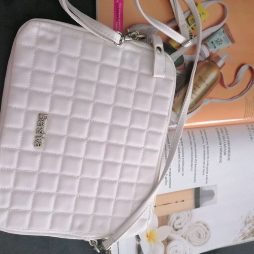 Tablet bag with slight wear on strap
