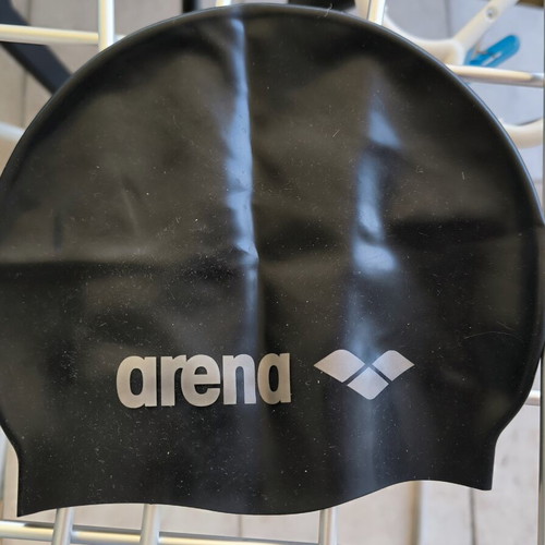 Three branded swimming caps