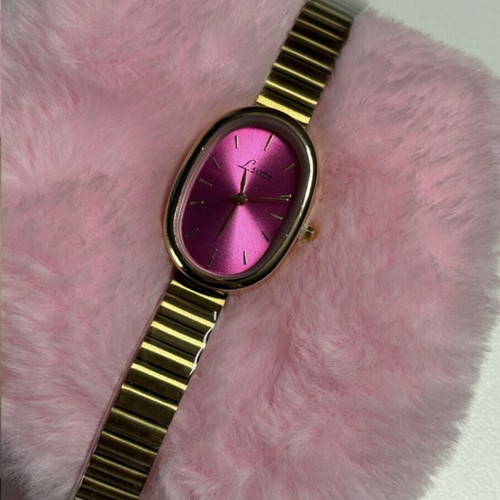 Gold watch with fuchsia dial like new, women's