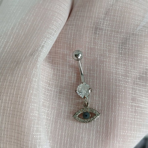 Navel piercing like new with eye charm and silver diamond