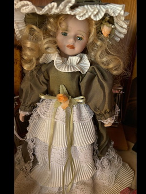 Porcelain doll new with vintage clothes collectible