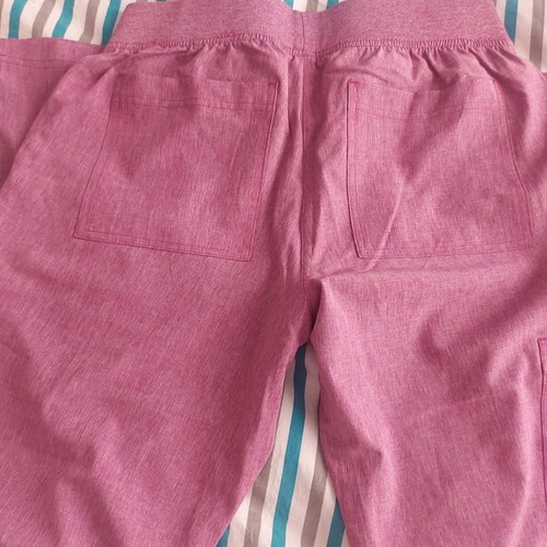 Koi nursing scrub new unworn, size S, rotten apple color