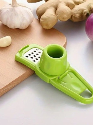 Garlic press new, manual plastic for vegetables and ginger