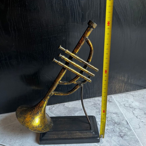 Vintage brass decorative musical instrument with black base, 30 cm