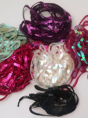 Sequins in trim with iridescent and solid colors for sewing and decoration