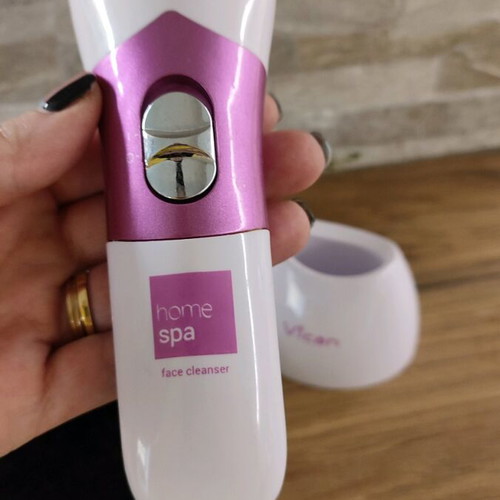 Facial cleansing device used with two heads and stand