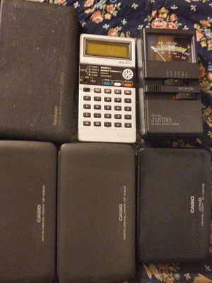 Collection of 6 handheld calculators including Casio, Sharp, and guitar tuner