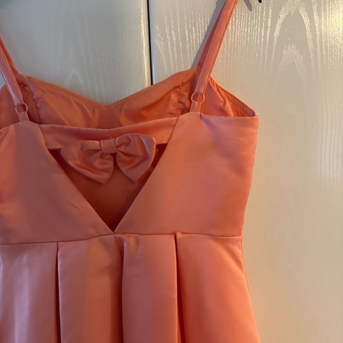 Peach dress like new size L with bow detail on back