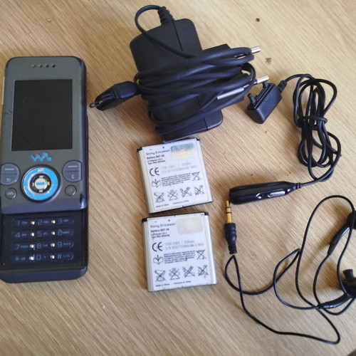 Sony Ericsson w580i used for parts with charger, headphones, and batteries