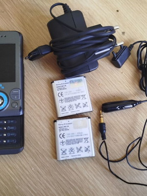 Sony Ericsson w580i used for parts with charger, headphones, and batteries
