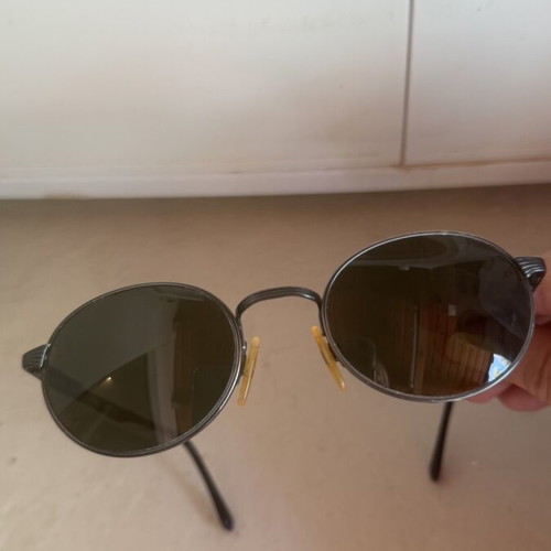 Luxottica vintage sunglasses with scratch-resistant lenses and case used
