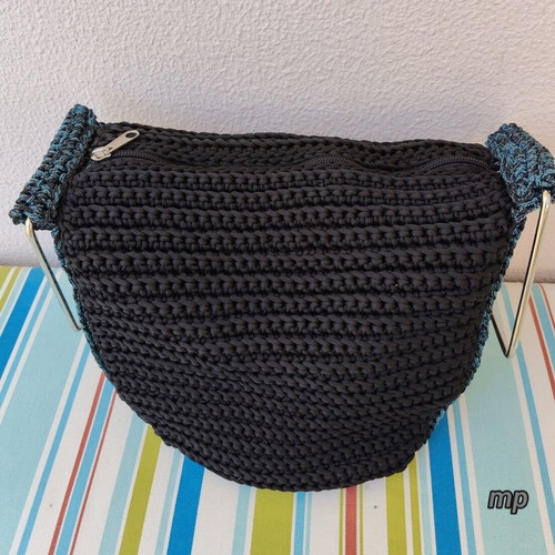 Handmade knitted bag with metal handles and inner lining