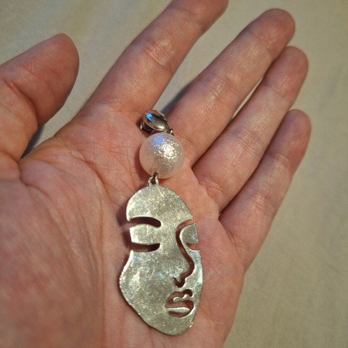 Handmade face earring silver used