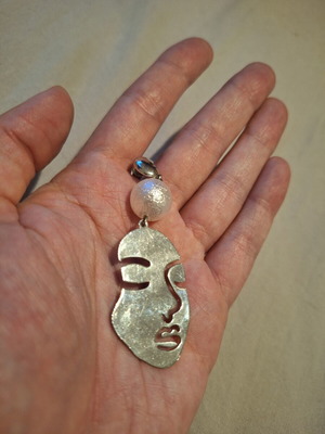 Handmade face earring silver used