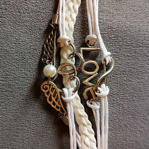 Love bracelet set new with white cords and charms