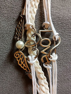 Love bracelet set new with white cords and charms