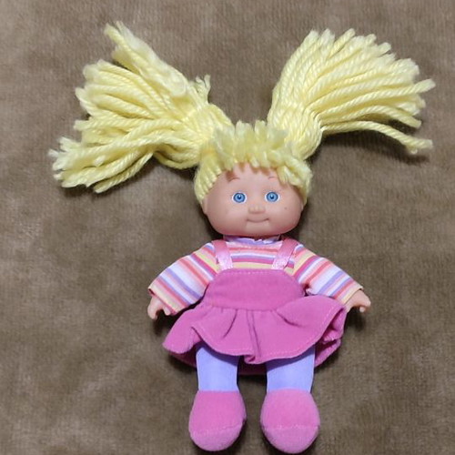 Small cloth doll with bed like new