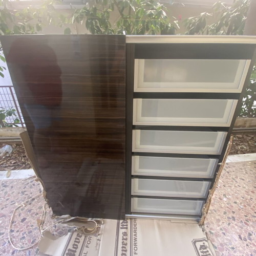 Wooden shelf unit used with adjustable shelves, dark finish
